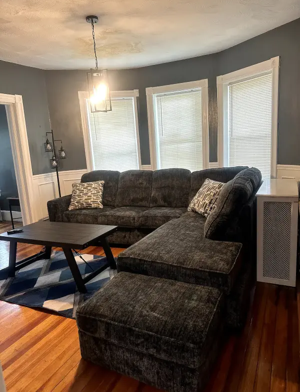 A living room with a couch and table