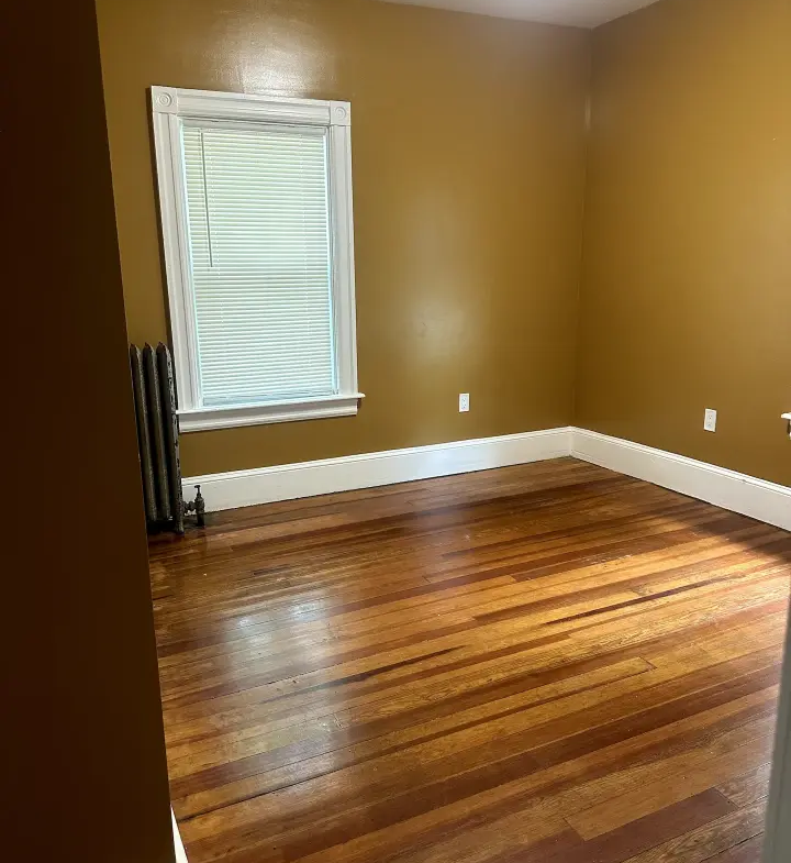 A room with wood floors and walls.