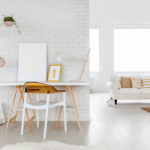 A white room with a table and chairs