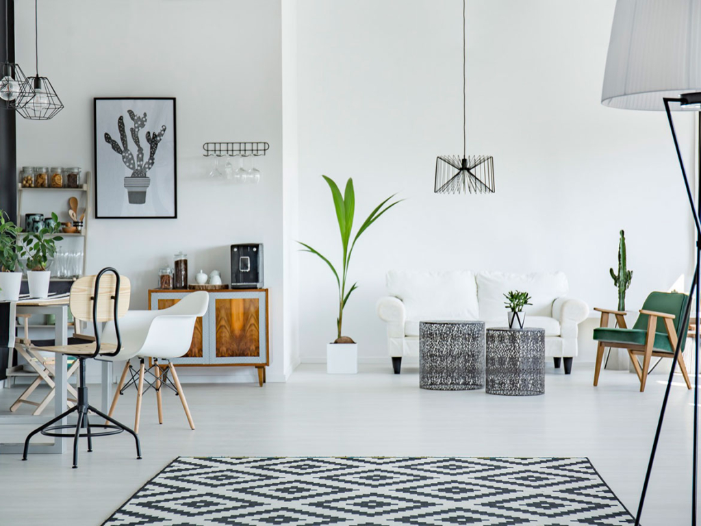 A living room with white walls and furniture.