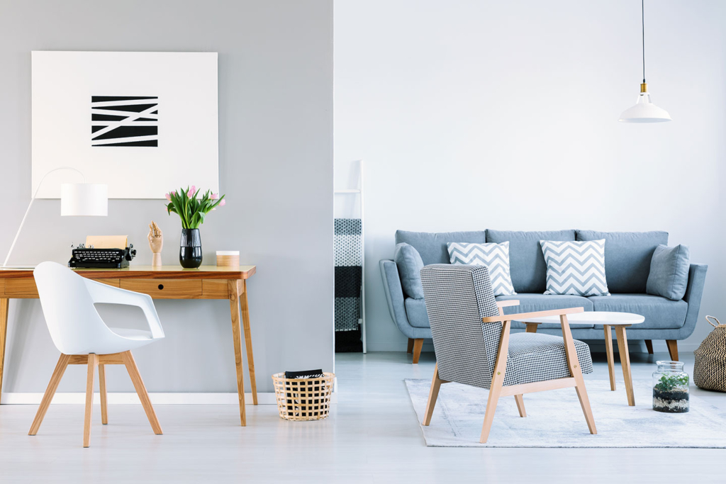 A living room with two chairs and a table