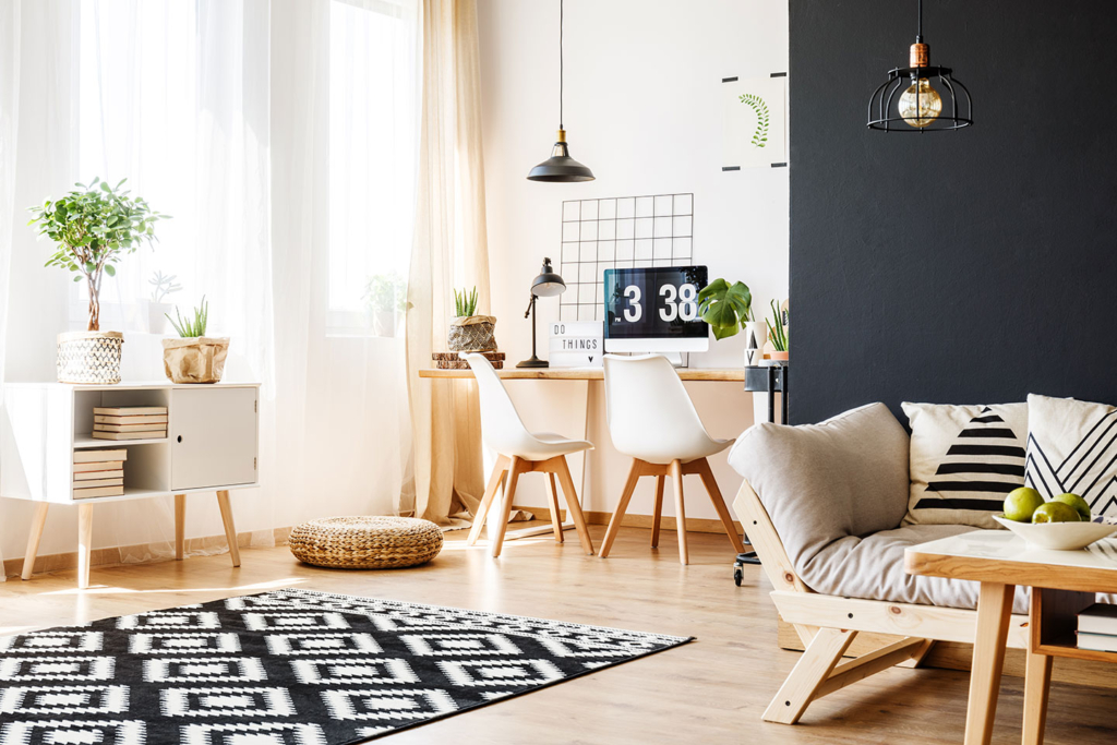 A living room with a couch, chair and table.