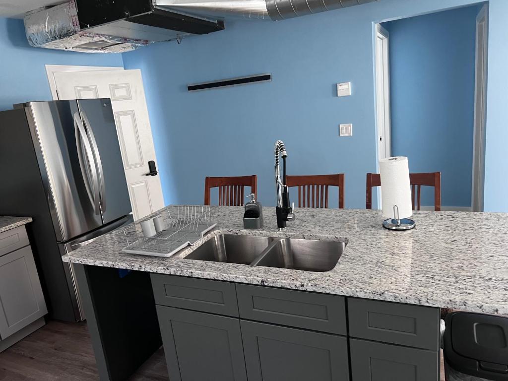 A kitchen with an island and sink in it