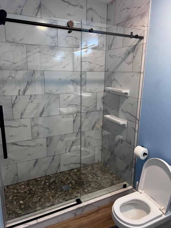 A bathroom with marble walls and floor