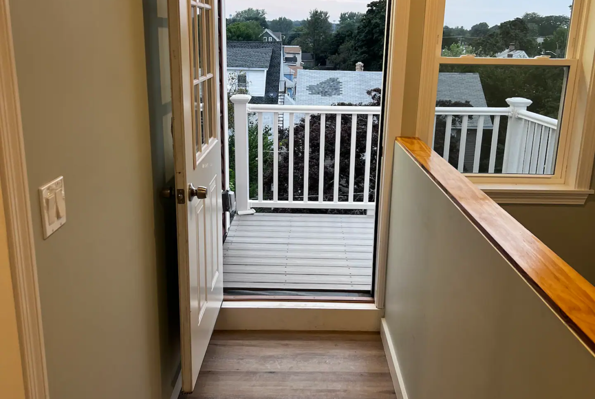 A door way leading to the deck of a house.